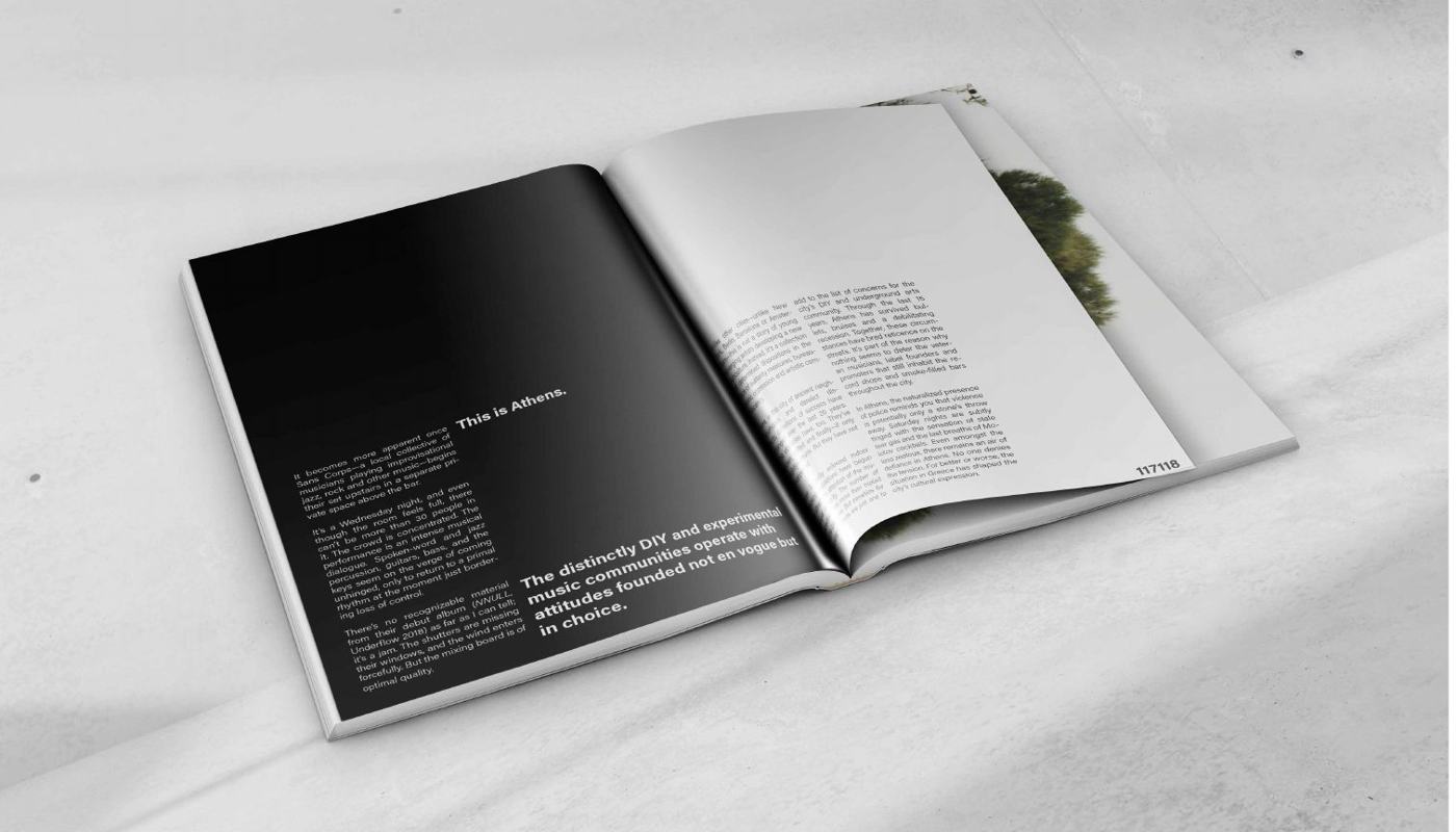 Open spread with a full black page facing text